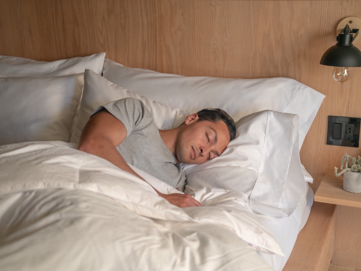 The FluffCo down-alternative pillow in use — advertiser product photography